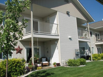 Exterior view of senior apartments with landscaping