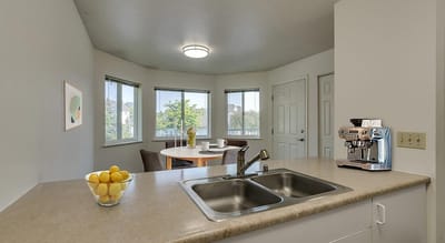 Bright, airy interior of a kitchen area with a dining table