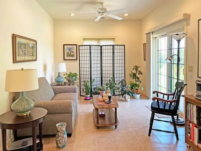 Cozy common area with comfortable furniture and plants