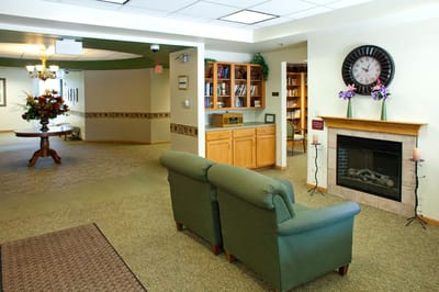 Interior common area with seating and a fireplace