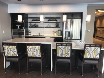 Modern kitchen with bar seating in a cozy common area