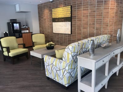 A cozy seating area in a common room with decorative elements