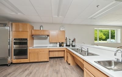 Bright kitchen area with counters and appliances