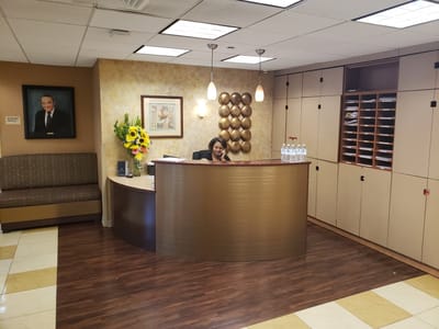 Reception area with staff member at desk