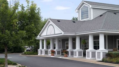 Front entrance of a senior living facility with columns