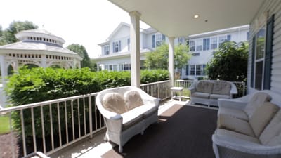Outdoor seating area with a gazebo and landscaped garden