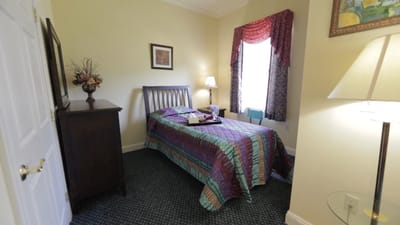 Cozy bedroom with colorful bedding and soft lighting