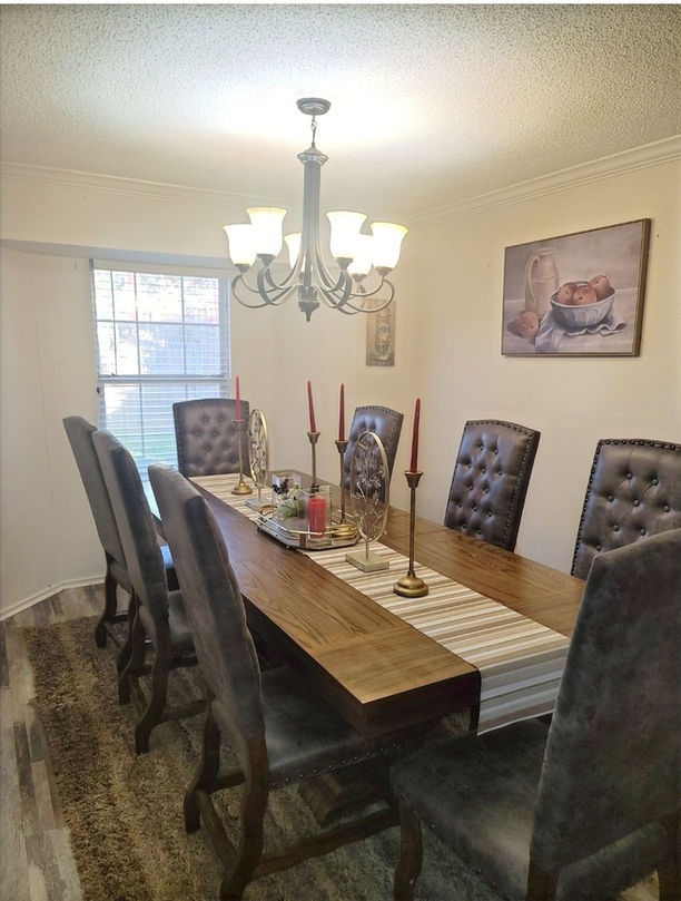 Elegant dining area with a long table and candles
