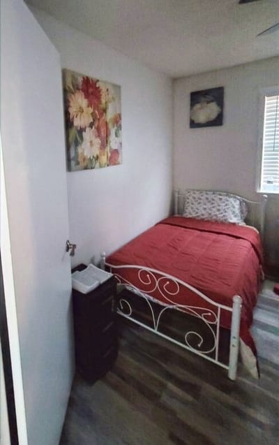 Cozy private room with bed and decor