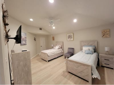 Interior view of a shared bedroom with two beds