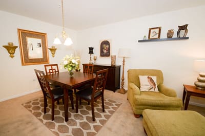 A cozy dining area with a table and chairs