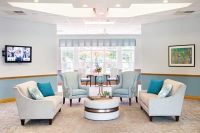 Bright common area with comfortable seating and natural light