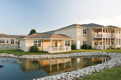 Exterior view of the Randall Residence building by a pond
