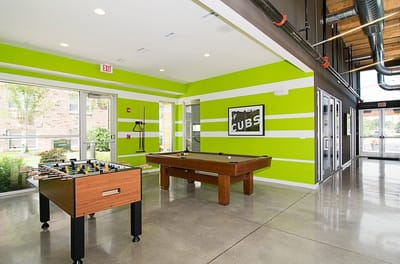 Bright activity room with games and foosball table