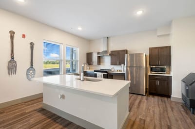 Modern kitchen area with appliances and countertops
