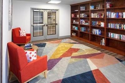 Cozy reading area with bookshelves and seating