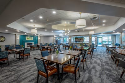 Spacious dining area with tables and chairs