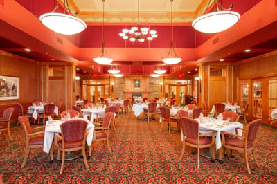 Elegant dining room setup with tables and chairs