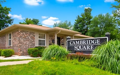 Exterior view of Cambridge Square Apartments building and signage