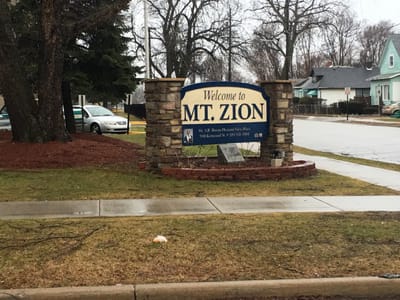 Welcome sign for Mount Zion Pleasant View Manor Apartments