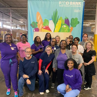 Group photo of staff members at a food bank event
