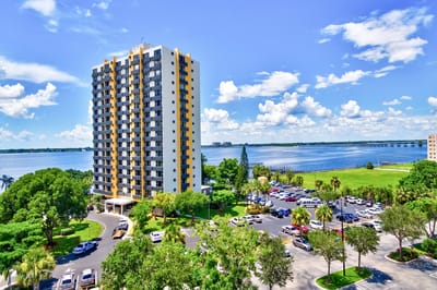 Aerial view of a senior living facility by the water