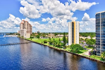 Aerial view of a waterfront community with buildings