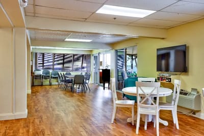 Bright interior common area with seating and tables