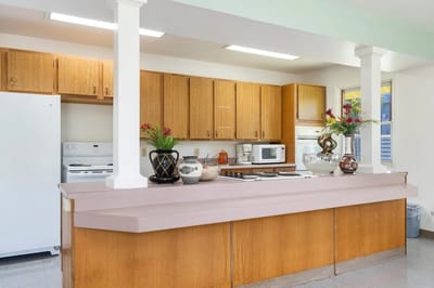 Bright, modern kitchen area with wooden cabinets