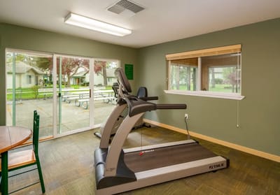 Interior view of a fitness area with treadmill