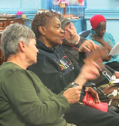 Residents engaged in conversation in a common area