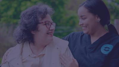Staff member engaging with resident outdoors