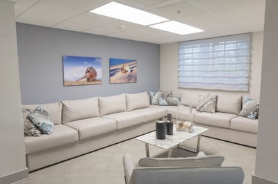 Comfortable common area with seating and artwork