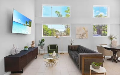 Bright common area with modern furnishings and windows