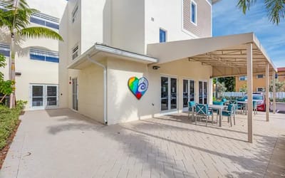 Outdoor seating area with colorful heart mural
