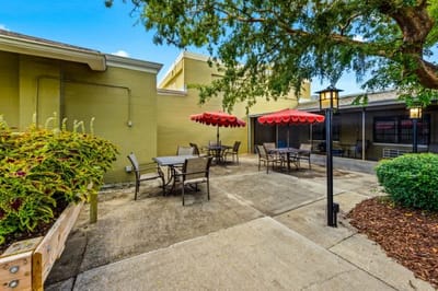 Outdoor patio area with tables and umbrellas