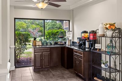 Interior cafe area with beverage station and outdoor view
