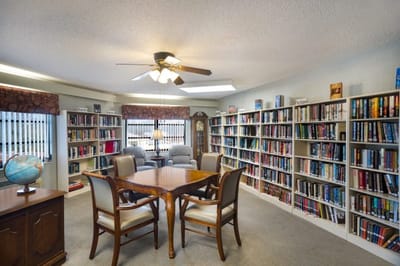Common area with bookshelves and seating