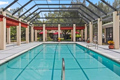 Pool area with seating and covered patio