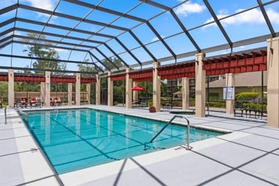 Outdoor swimming pool area with lounge chairs