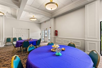 Bright common area with tables set for an event