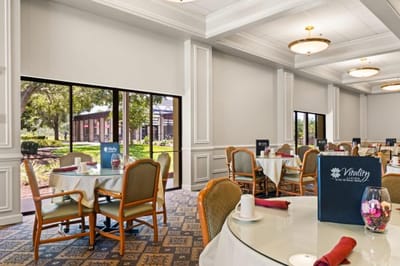 Bright dining room setup with tables and chairs
