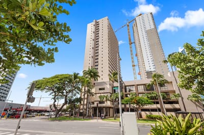 Exterior view of the Pohulani facility with palm trees