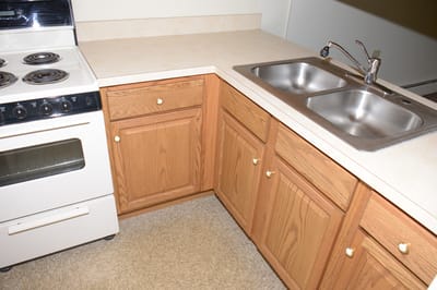 Corner kitchen with stove and sink