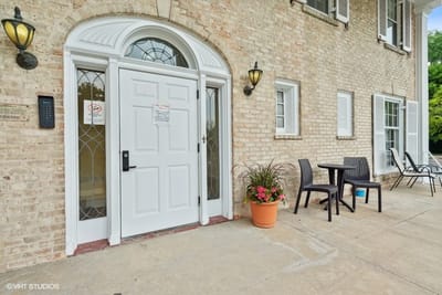 Front entrance of The Terrace Apartments with seating area