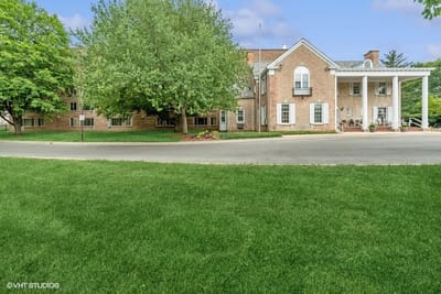 Exterior view of The Terrace Apartments with green lawn
