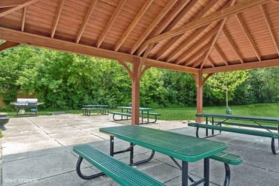Covered outdoor seating area with picnic tables