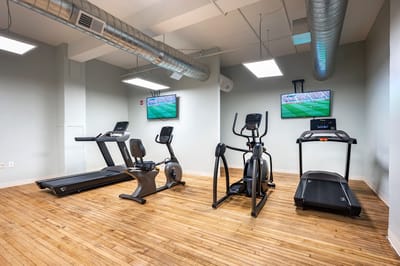 Well-equipped fitness room with exercise machines