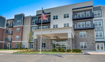 Front entrance of a senior living facility with landscaping