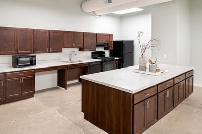 Modern kitchen space with cabinets and appliances